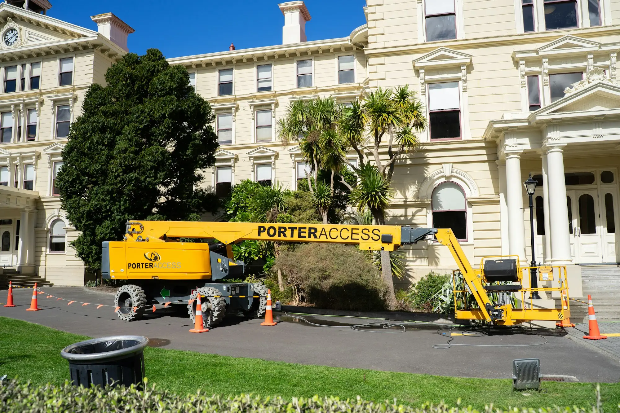 Boom lift parked outside a heritage building