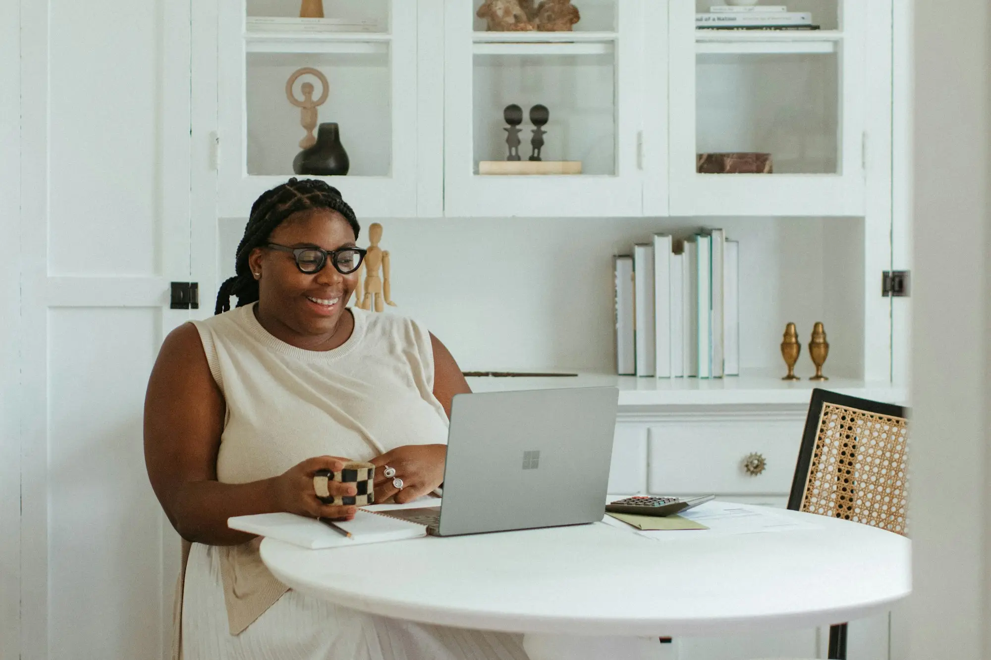 Business owner working at a laptop at home