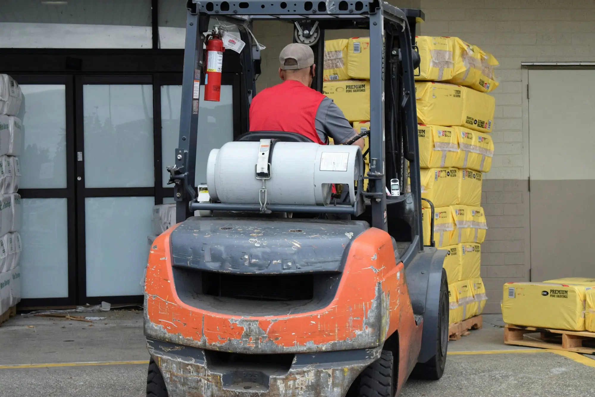 Man driving a forklift in a warehouse